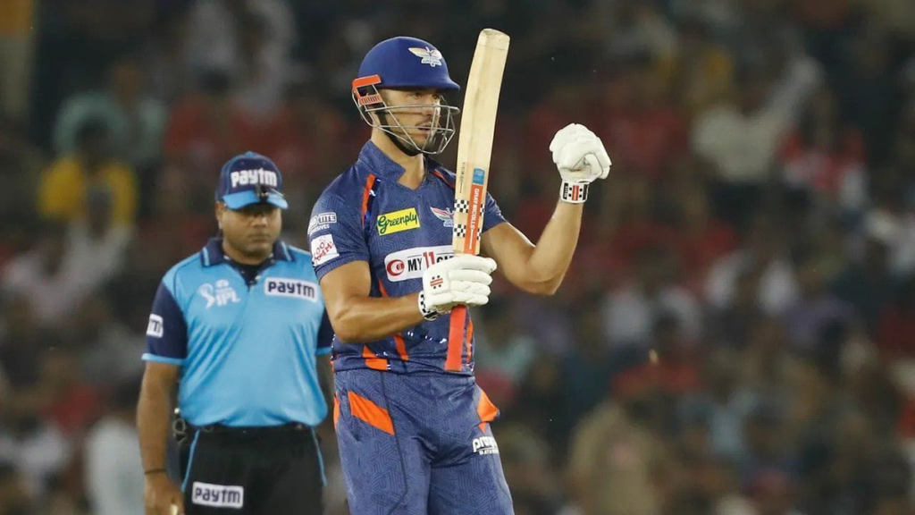 Marcus Stoinis raises his bat after his fifty in the LSG highest score in IPL 257-5 Mohali mayhem