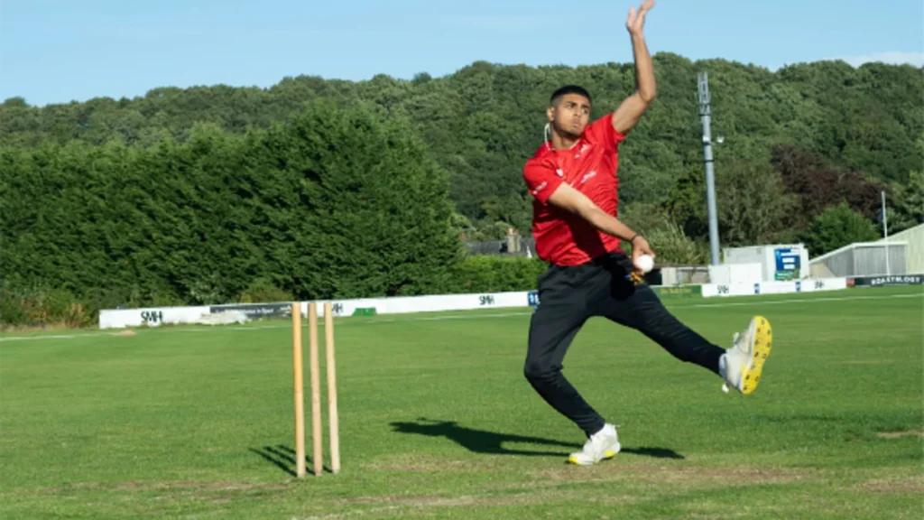 Young bowler in delivery stride, bowling basics for beginners learning how to play cricket