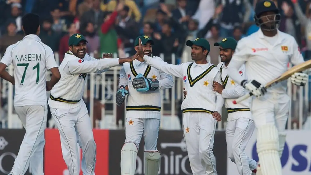 pakistan sri lanka test series 2026 schedule - Pakistan players celebrate a wicket against Sri Lanka in a Test match