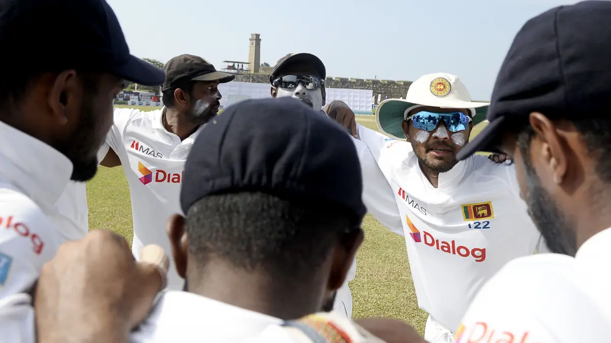 sri lanka test squad pakistan tour 2026 - Sri Lanka Test players in a team huddle during a Test match